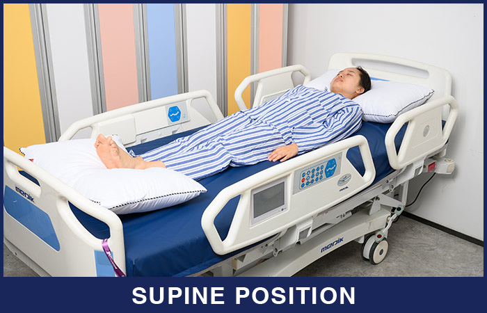 Patient setup with the abdominal compression device (a) located in